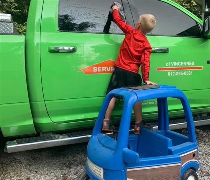 Owner of SERVPRO of Vincennes's son washing company vehicle